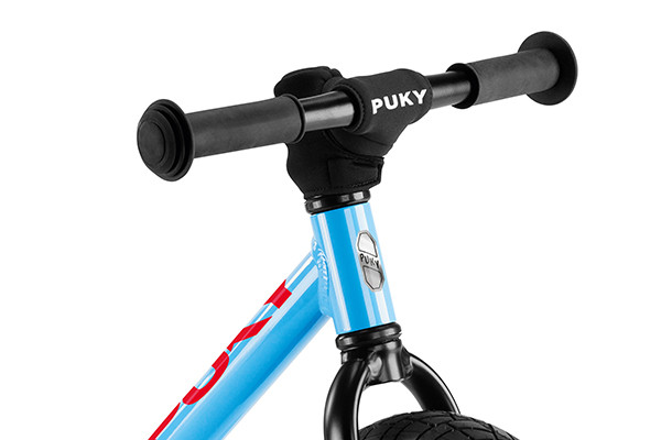 Mit Puky Lenkerpolster.