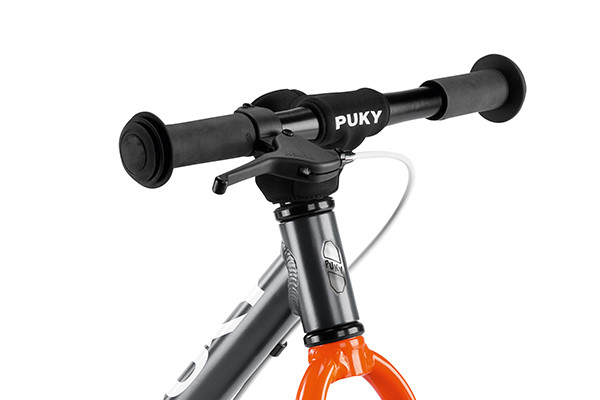 Mit Puky Lenkerpolster.