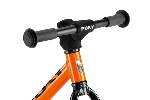 Mit Puky Lenkerpolster.